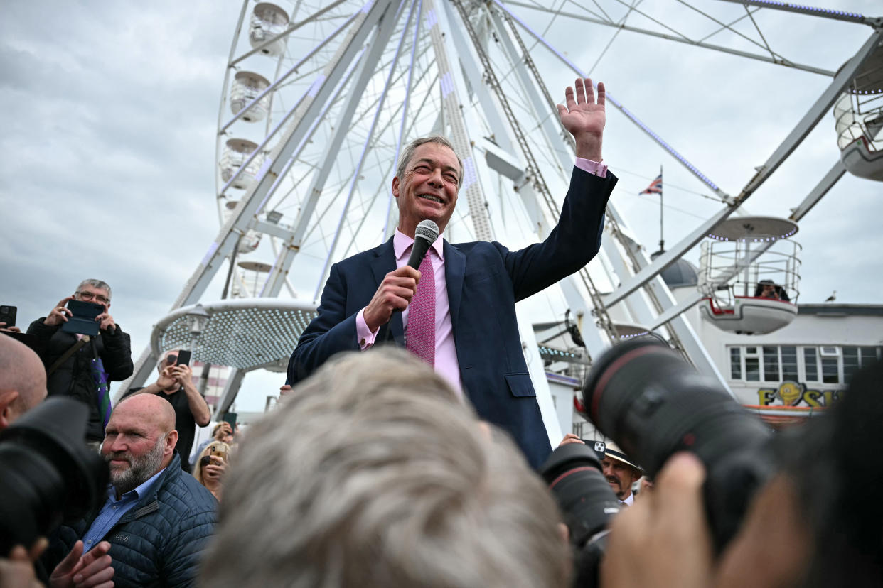 TOPSHOT - Newly appointed leader of Britain's right-wing populist party, Reform UK, and the party's parliamentary candidate for Clacton, Nigel Farage, addresses supporters during his general election campaign launch in Clacton-on-Sea, eastern England, on June 4, 2024. Nigel Farage on Monday said he would stand as a candidate for the anti-immigration Reform UK party in Britain's general election next month, after initially ruling out running. 