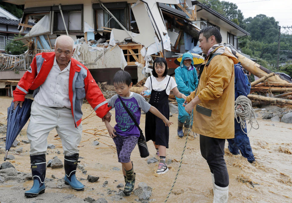 <p>Residents flee from an isolated school in Asakura, Fukuoka prefecture, southwestern Japan Thursday, July 6, 2017. (Photo: Takuto Kaneko/Kyodo News via AP) </p>