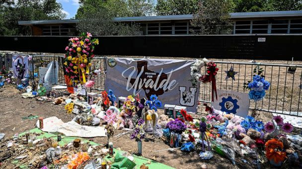 PHOTO: Mementos decorate a makeshift memorial to the victims of a shooting at Robb Elementary School in Uvalde, Texas, June 30, 2022. (Chandan Khanna/AFP via Getty Images)