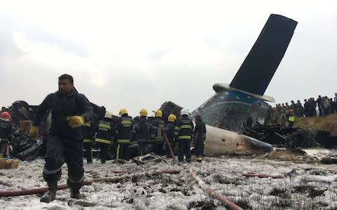 The plane was carrying 67 passengers when it crashed on landing - Credit:  Niranjan Shreshta/ AP