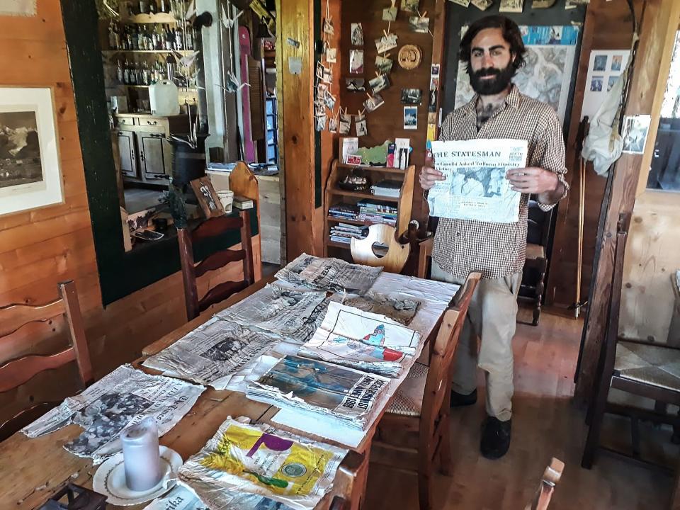 Thimotee Mottin, manager  Cabane du Cerro near the Bossons glacier, poses with copies of Indian newspapers likely to have been on board the Air India Boeing 707 in 1966.  Source: AFP/Getty Images