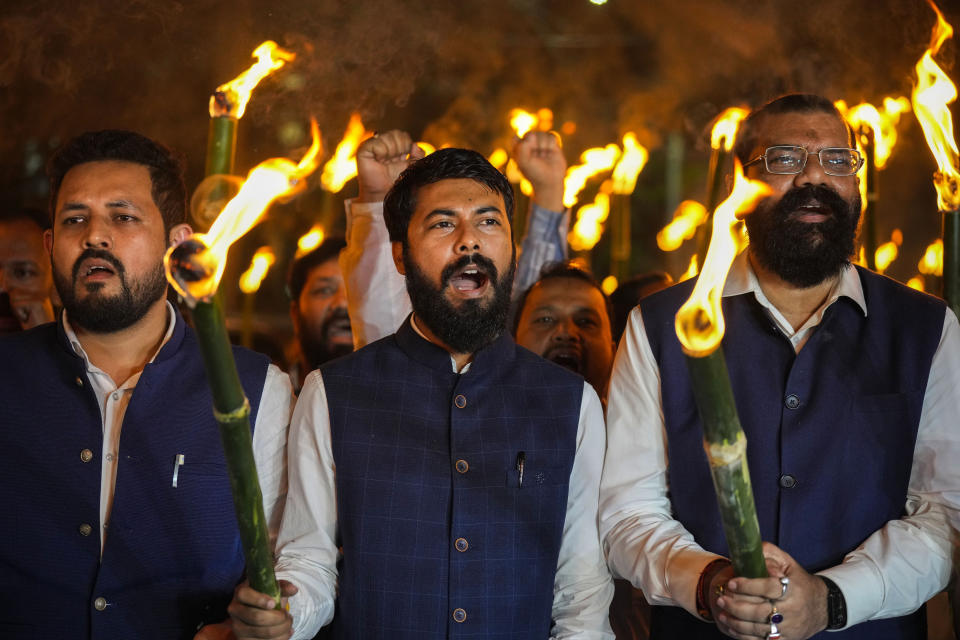 All Assam Students Union (AASU) leaders with their members take out a torch procession to protest against the Citizenship Amendment Act (CAA) in Guwahati, India, Tuesday, March 12, 2024. India has implemented a controversial citizenship law that has been widely criticized for excluding Muslims, a minority community whose concerns have heightened under Prime Minister Narendra Modi's Hindu nationalist government. The act provides a fast track to naturalization for Hindus, Parsis, Sikhs, Buddhists, Jains and Christians who fled to Hindu-majority India from Afghanistan, Bangladesh and Pakistan before Dec. 31, 2014. (AP Photo/Anupam Nath)