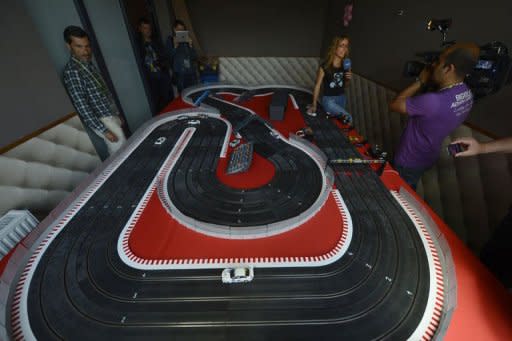 Journalists take visit the "Scalextric" game room at the Spain's football team base camp in the hotel Mistral Sports in Gniewino on June 15 during the Euro 2012 football championships. Spain threw open the doors of their secluded hideaway in northern Poland to offer fans a tantalising glimpse of just how European and world champions live