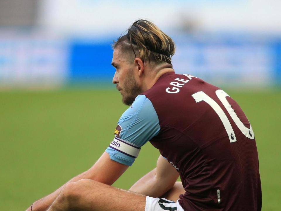 Aston Villa's Jack Grealish sits dejected: PA