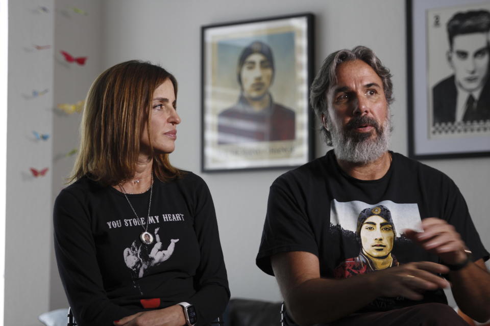 Manuel and Patricia Oliver, the parents of Joaquin Oliver, one of the victims of the 2018 mass shooting at Marjory Stoneman Douglas High School in Parkland, Fla., sit for an interview in Coral Springs, Fla., on Friday Feb. 9, 2024. The Olivers are launching a campaign where re-created voices of gun violence victims will call federal lawmakers. The recordings re-creating voices of victims from around the country are being robocalled to U.S. senators and House members who oppose stricter gun laws. (AP Photo/Cody Jackson)