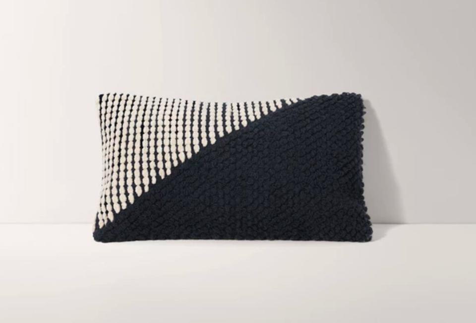 This 12 x 12 rectangle pillow cover is hand-woven with wool and cotton in contrasting colors. <strong><a href="https://fave.co/30Ac5jK" target="_blank" rel="noopener noreferrer">Find it for $55</a>.</strong>