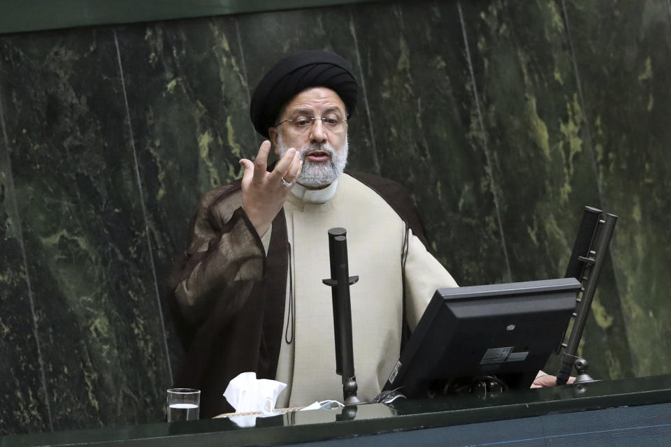 FILE - Iranian President Ebrahim Raisi addresses the parliament during a vote of confidence session for the education minister, in Tehran, Iran, Tuesday, Nov. 16, 2021. Iran and world powers resume talks in Vienna this week of Nov. 28, aimed at restoring the nuclear deal that crumbled after the U.S. pulled out three years ago. There are major doubts over whether the deal can be reinstated after years of mounting distrust.(AP Photo/Vahid Salemi)