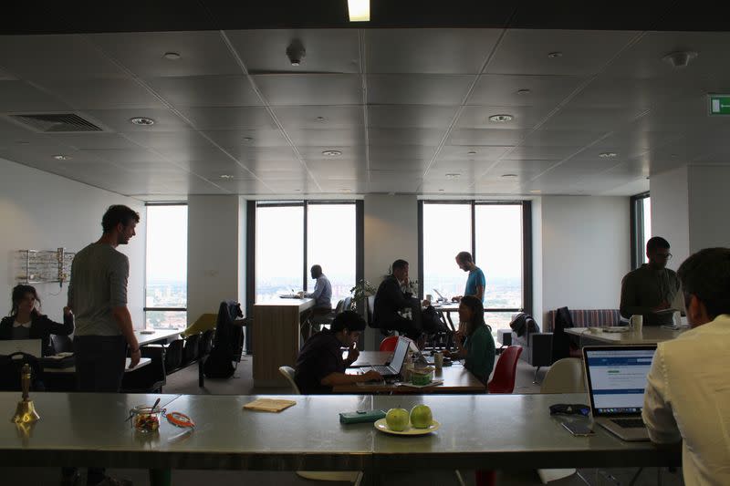 People are seen in the Level39 FinTech hub based in the One Canada Square tower of the Canary Wharf district of London