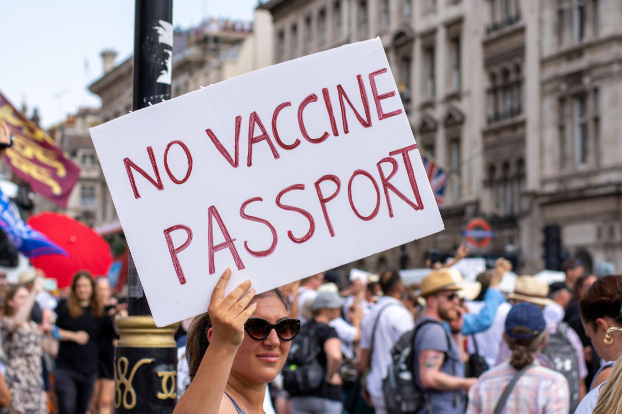 LONDON, UNITED KINGDOM - 2021/07/19: A protester holds a placard expressing her opinion during the demonstration.
Thousands of people gathered near Parliament Square in a protest against health passports, protective masks, Covid-19 vaccines and lockdown restrictions. (Photo by Pietro Recchia/SOPA Images/LightRocket via Getty Images)