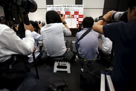 Japanese figure skater Mao Asada (C) attends a news conference in Tokyo May 18, 2015. REUTERS/Issei Kato