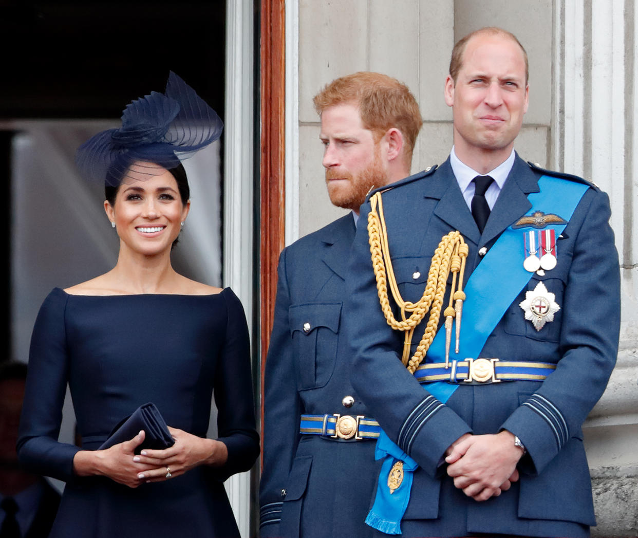 LONDON, UNITED KINGDOM - JULY 10: (EMBARGOED FOR PUBLICATION IN UK NEWSPAPERS UNTIL 24 HOURS AFTER CREATE DATE AND TIME) Meghan, Duchess of Sussex, Prince Harry, Duke of Sussex and Prince William, Duke of Cambridge watch a flypast to mark the centenary of the Royal Air Force from the balcony of Buckingham Palace on July 10, 2018 in London, England. The 100th birthday of the RAF, which was founded on on 1 April 1918, was marked with a centenary parade with the presentation of a new Queen's Colour and flypast of 100 aircraft over Buckingham Palace. (Photo by Max Mumby/Indigo/Getty Images)