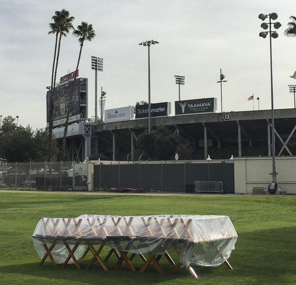 Stacked tables in the makeshift parking lot at the Rose Bowl in Pasadena, Calif. (Chuck Culpepper/The Washington Post)