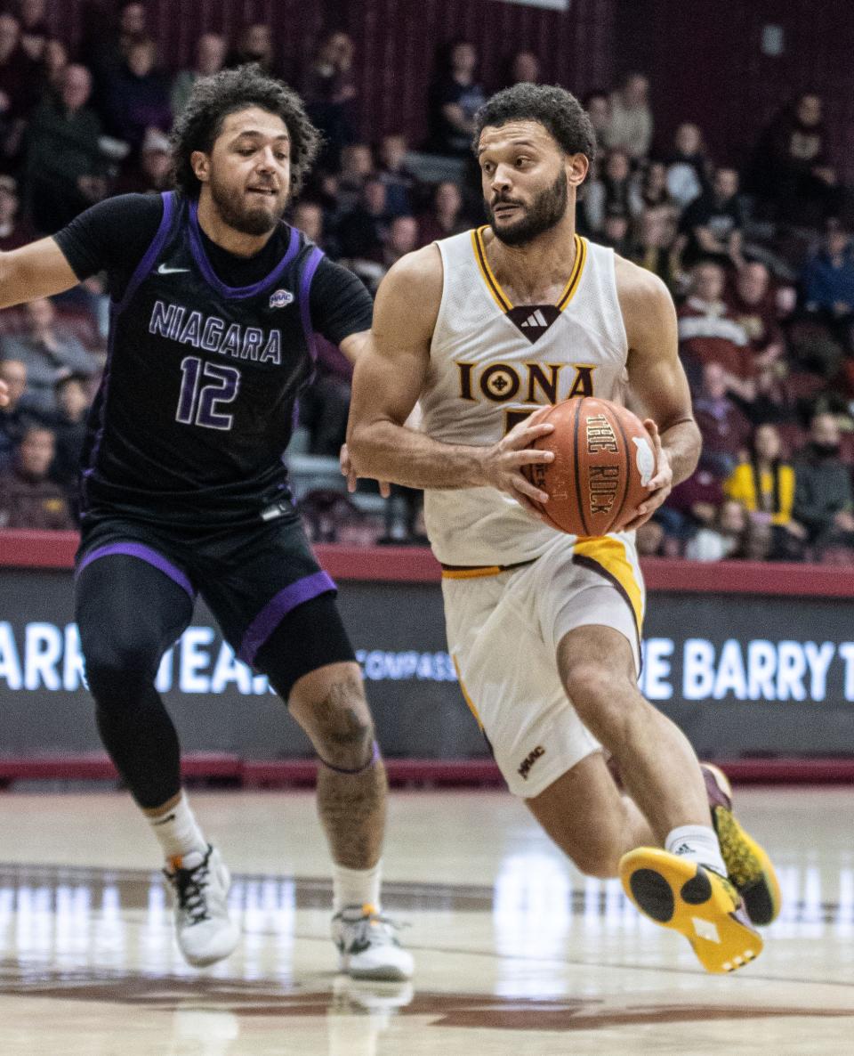 Dan Tretout of Iona drives on Kwane Marble, Jr. of Niagara during a MAAC conference basketball game at Iona University in New Rochelle Jan. 7, 2024. Niagara defeated Iona 75-73 with a last second three point basket.
