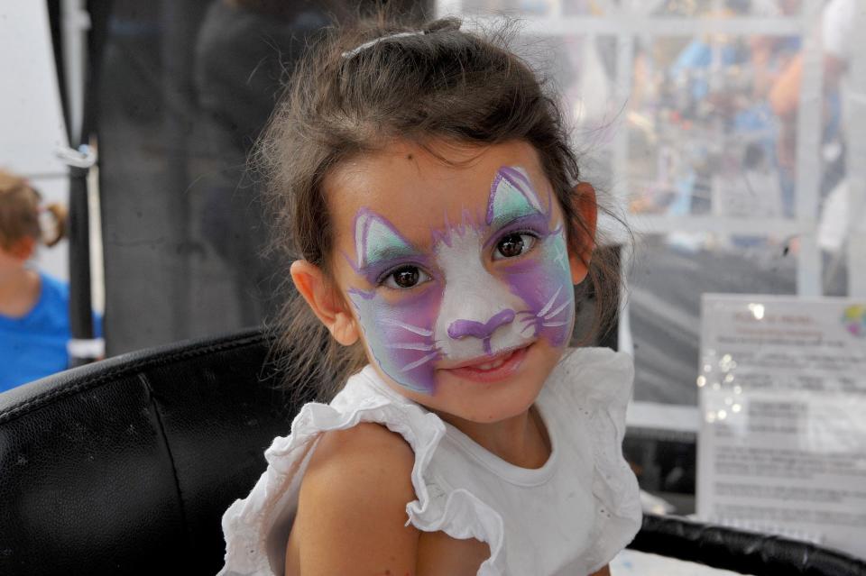 Betsy Allen, aged three, enjoying having her face painted (Photo: Steve Riding)
