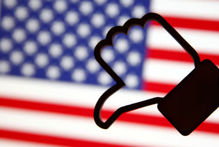 A 3D-printed Facebook Like symbol is displayed inverted in front of a U.S. flag in this illustration taken, March 18, 2018. REUTERS/Dado Ruvic/Illustration