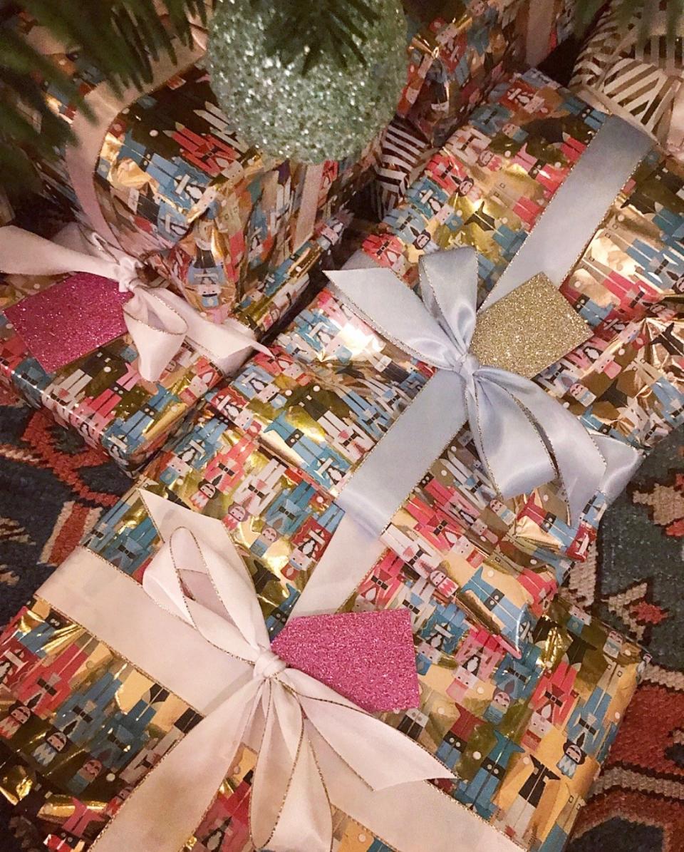 I really love wrapping. This year’s was colored nutcrackers, satin bows, and glitter tags.