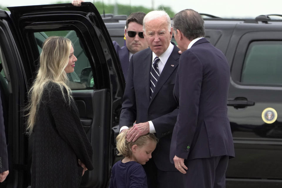 President Joe Biden talks with his son Hunter Biden and wife Melissa Cohen Biden, and grandson Beau, as he arrives Delaware Air National Guard Base in New Castle, Del., Tuesday, June 11, 2024. (AP Photo/Manuel Balce Ceneta)