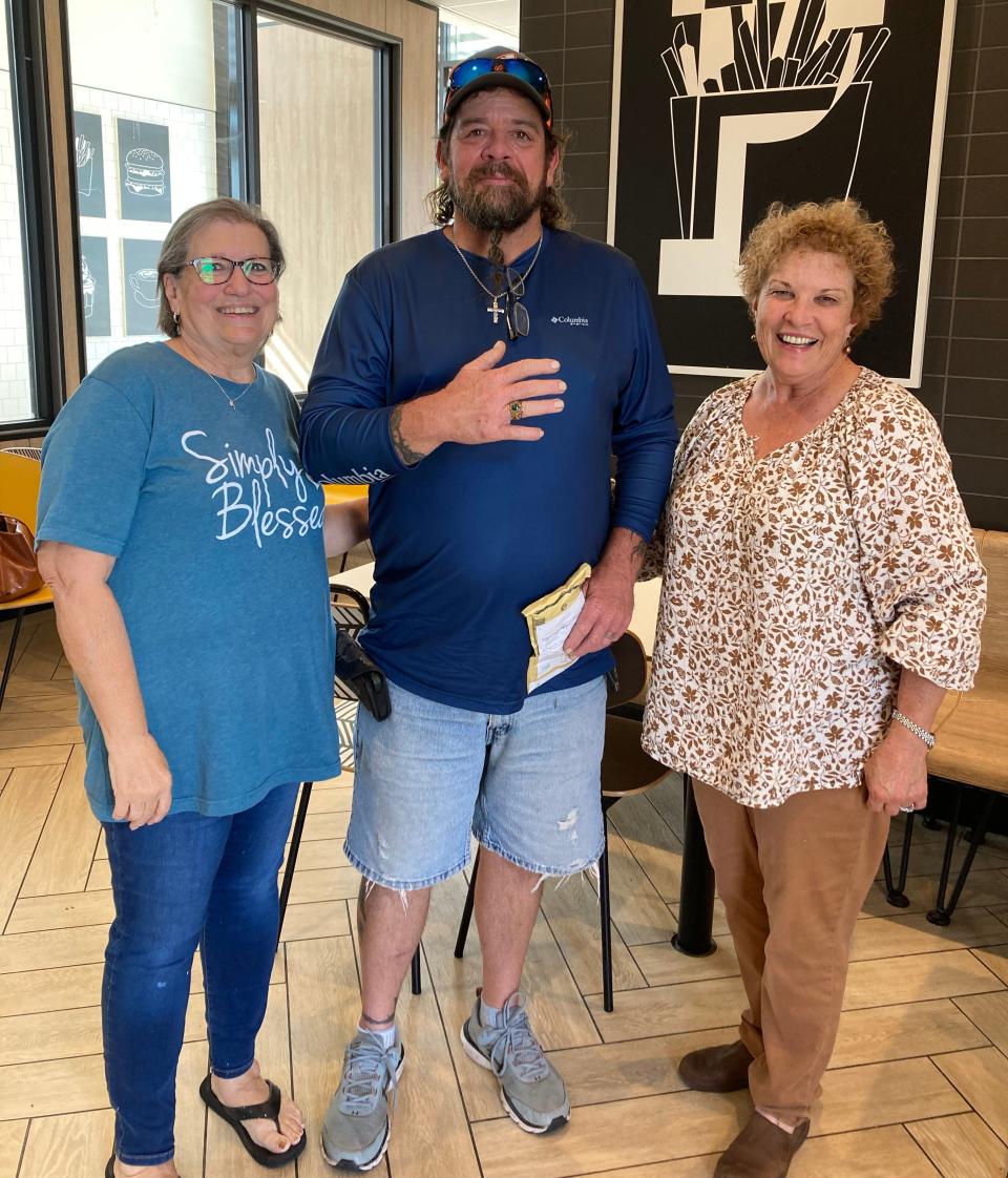 Jennifer Brignac Authement (left), Darrell Callais Jr. and Laura Ann Browning meet July 27, 2022, at the Prospect Street McDonald's in Houma. The two Terrebonne Parish women helped get the high school ring that belonged to Callais' late father returned from Ireland.