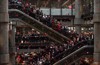 <p>Red poppies fall from above as employees observe a minute’s silence in commemoration of Remembrance Day, inside Lloyd’s of London in the city of London on Nov. 9, 2018. – Nov. 11, 2018 is the 100th anniversary of the end of WWI. In the run-up to Armistice Day, many Britons wear a paper red poppy — symbolising the poppies which grew on French and Belgian battlefields during World War I. (Photo from Ben Stansall/AFP/Getty Images) </p>