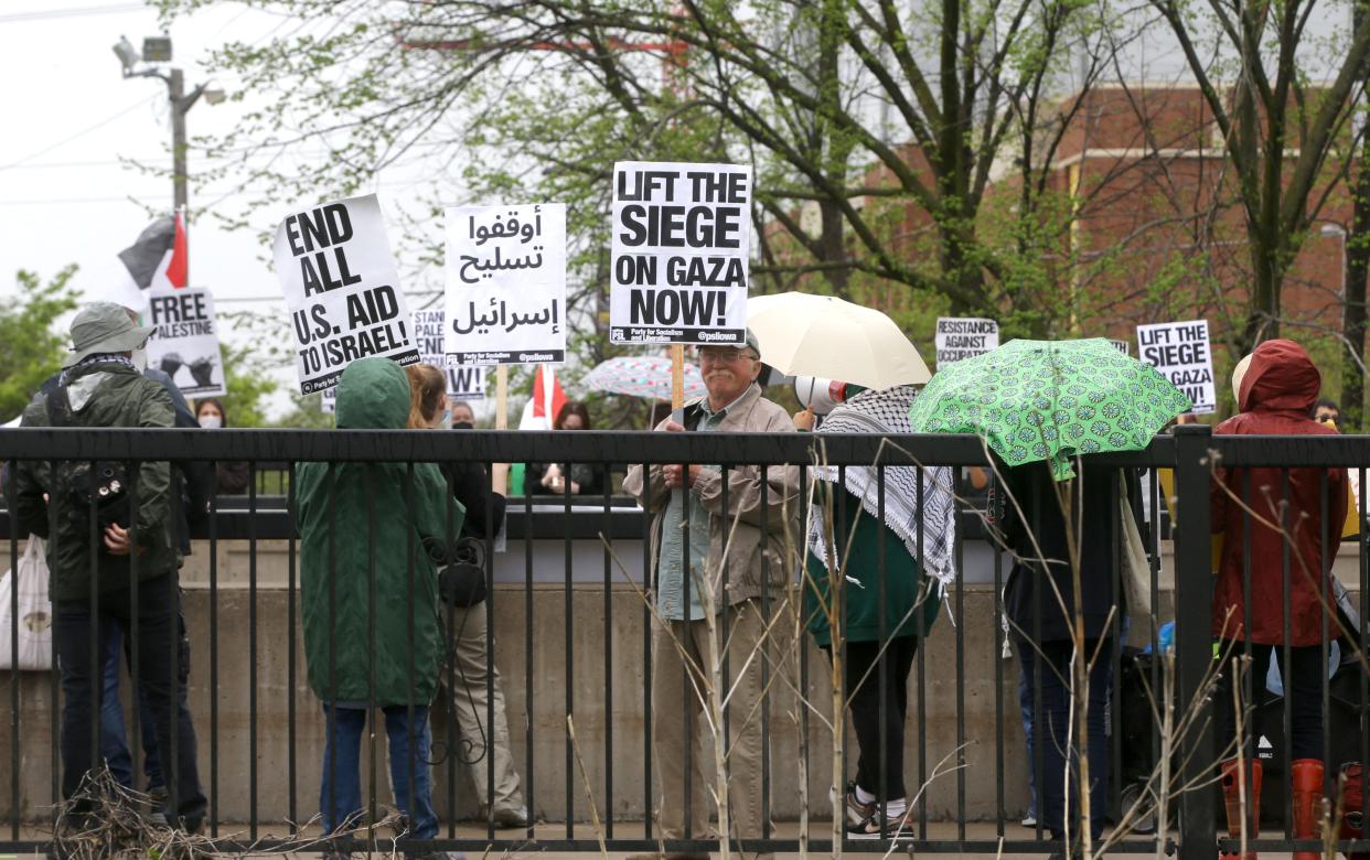 Pro-Palestinian protesters gather outside of Congresswoman Mariannette Miller-Meeks and Speaker of the House Mike Johnson’s event to demand a permanent ceasefire in Gaza Sunday, April 28, 2024 at the Courtyard by Marriott in Iowa City, Iowa.