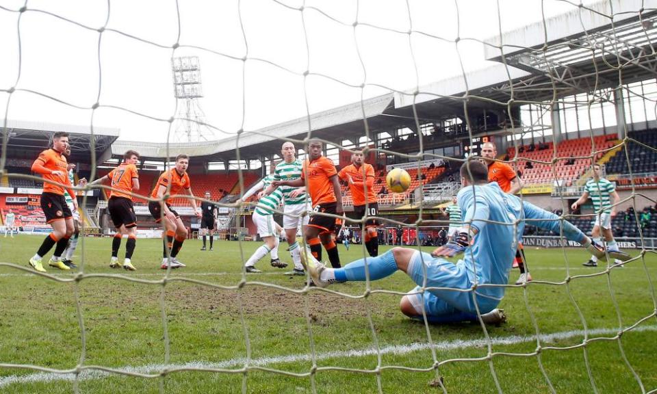 Dundee United goalkeeper Benjamin Siegrist makes a save to deny Celtic