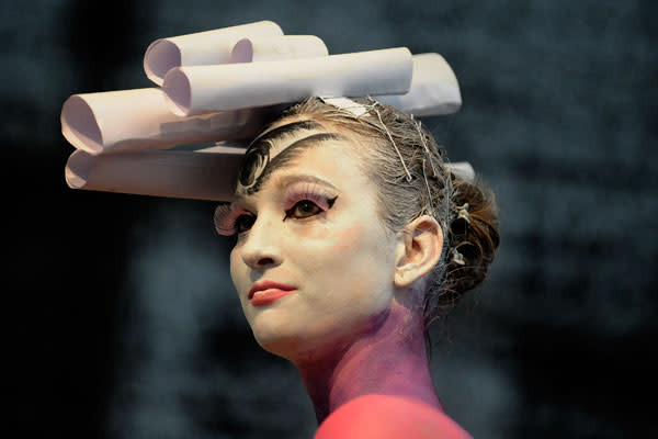 An artist paints a naked body during the IXth Cze ch Republic Body Painting Championships on March 31, 2012 as part of the ''Inter Beauty Prague 2012'' fair Prague. The theme of the contest is ''Lady from a picture of Czech Art Nouveau painter Alfons Mucha.''