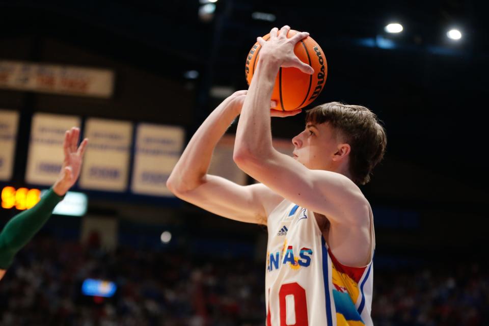 Kansas freshman guard Johnny Furphy (10) lines up a 3-pointer against Baylor during the first half of a game Feb. 10, 2024 inside Allen Fieldhouse.