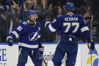 Tampa Bay Lightning center Steven Stamkos (91) celebrates his goal against the New York Rangers with defenseman Victor Hedman (77) during the first period of an NHL hockey game Friday, Dec. 31, 2021, in Tampa, Fla. (AP Photo/Chris O'Meara)