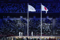 The Olympic flag is raised during the opening ceremony in the Olympic Stadium at the 2020 Summer Olympics, Friday, July 23, 2021, in Tokyo, Japan. (AP Photo/Kirsty Wigglesworth)