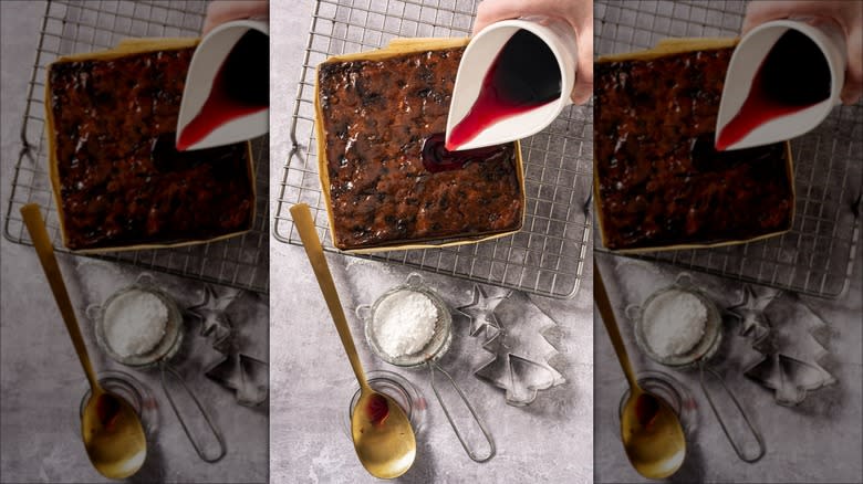 pouring wine over black cake