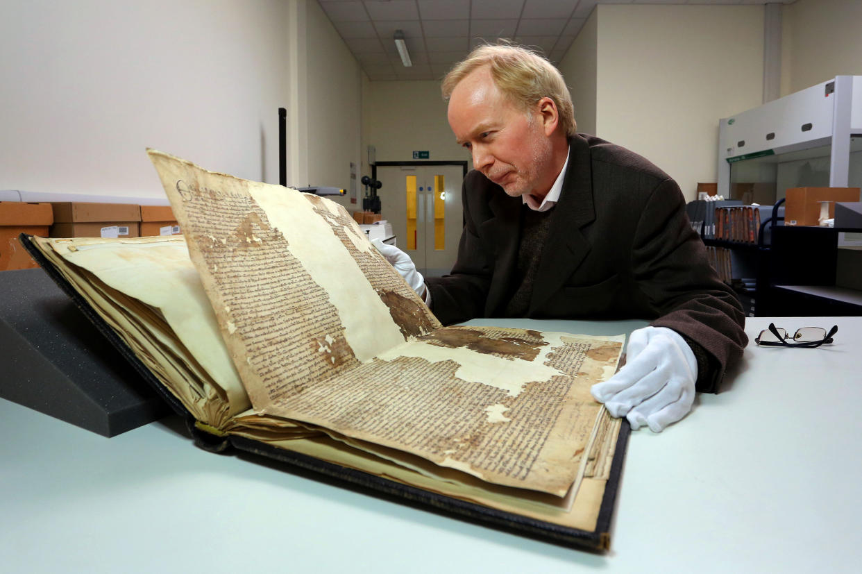 Dr. Mark Bateson, Community History Officer with Kent County Council with an original Magna Carta from the issue made in 1300 by King Edward l to the borough of Sandwich in Kent, which he recently discovered in the archives at Kent County Council's Kent History and Library Centre in Maidstone.