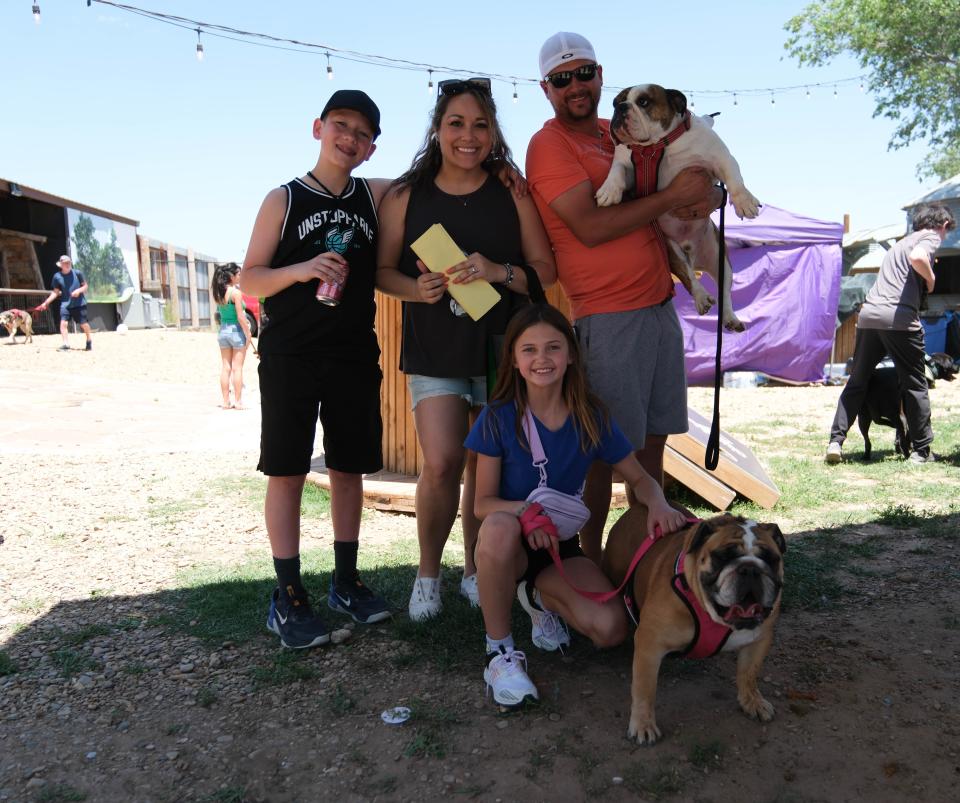 The Little family with their two English Bulldogs Sunday at the 30th annual Muttfest at the Starlight Ranch Event Center in Amarillo.