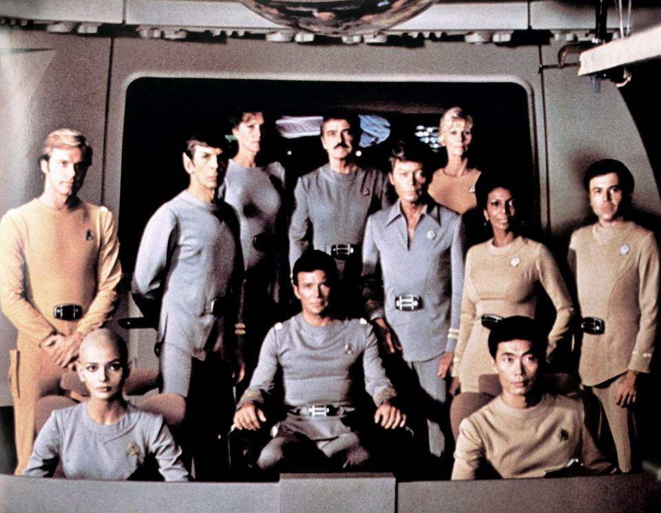 the cast all together in a the space ship