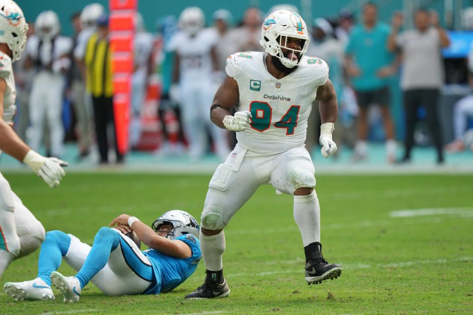 Miami Dolphins defensive tackle Christian Wilkins (94) celebrates a sack of Carolina Panthers quarterback Bryce Young (9) during the fourth quarter of an NFL game at Hard Rock Stadium in Miami Gardens, Oct. 15, 2023.