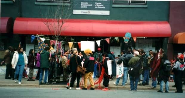 A group of people gather outside the Canada Employment Office on Gottingen Street in Halifax in 1996. The community started occupying the space after the closure of several other businesses in the area. (Lynn Jones/African Canadian and Diaspira Heritage Collection - image credit)