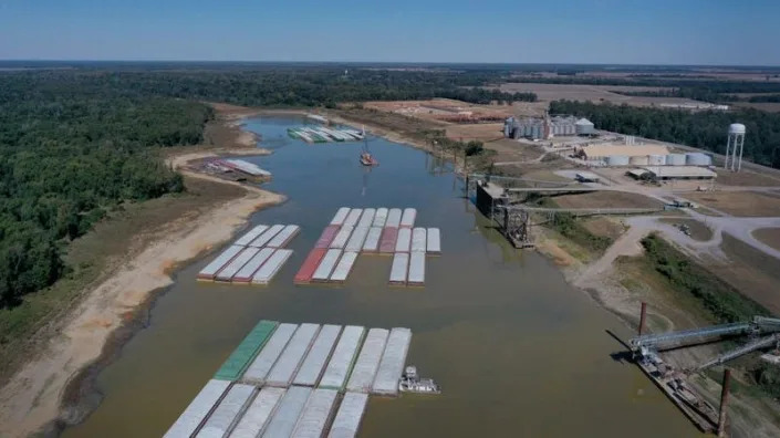 In this aerial view, barges, stranded by low water sit at the Port of Rosedale along the Mississippi River on October 20, 2022 in Rosedale, Mississippi. The lion fossil was found in the Rosedale area in October. 