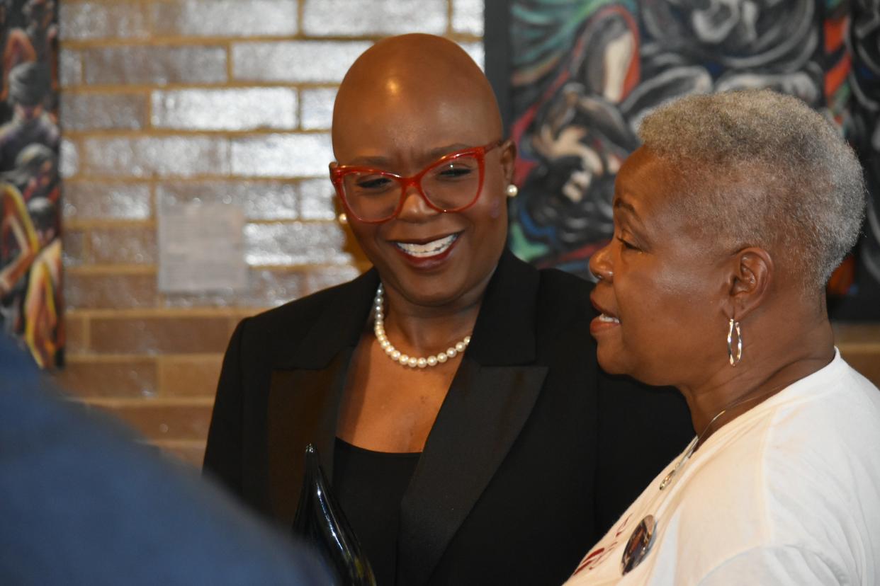 Counselor Marla Godette, left, speaks with Mamas Against Violence founder Bobbie Woods on Monday night after the YWCA North Central Indiana honored the two women for their work promoting racial justice at the Indiana University South Bend Civil Rights Heritage Center.