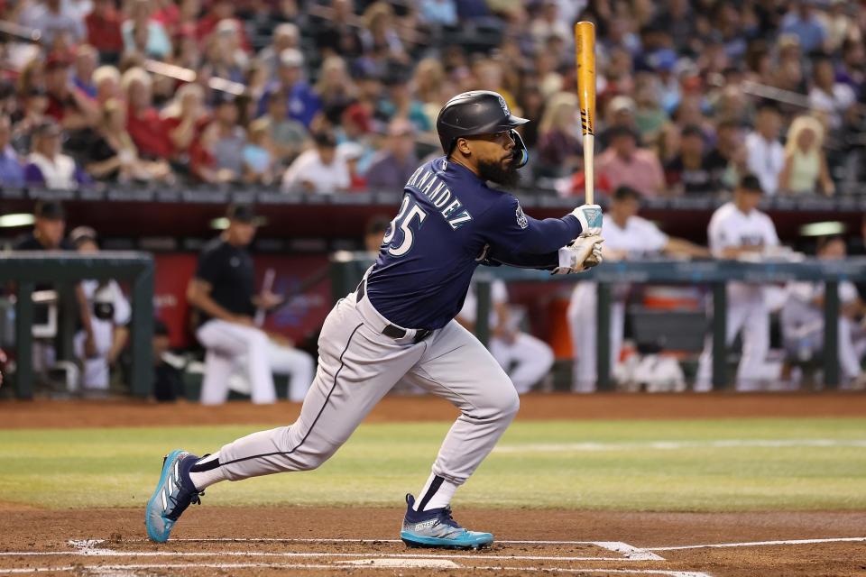 PHOENIX, ARIZONA - JULY 30: Teoscar Hernandez #35 of the Seattle Mariners hits a single against the Arizona Diamondbacks during the first inning of the MLB game at Chase Field on July 30, 2023 in Phoenix, Arizona. (Photo by Christian Petersen/Getty Images)