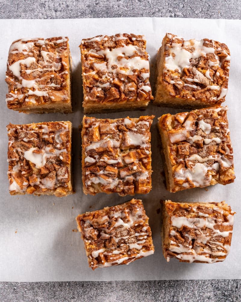 sliced apple fritter cake on white parchment