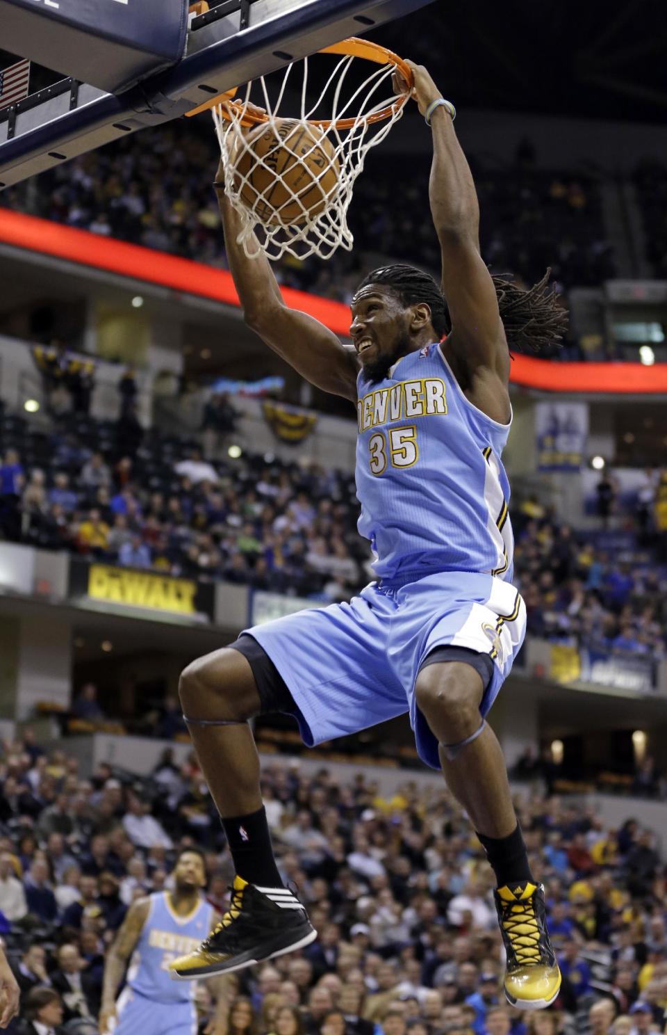 Denver Nuggets forward Kenneth Faried dunks against the Indiana Pacers in the first half of an NBA basketball game in Indianapolis, Monday, Feb. 10, 2014. (AP Photo/Michael Conroy)