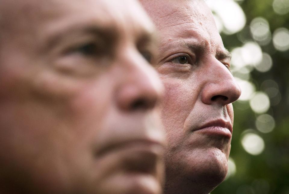 New York Mayoral candidate Bill de Blasio (R) stands near New York Mayor Michael Bloomberg during the 9/11 Memorial ceremonies marking the 12th anniversary of the 9/11 attacks on the World Trade Center in New York on September 11, 2013. (REUTERS/Adrees Latif)