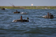 <p>Wave breakers are seen along the “Uppards,” part of Tangier Island, Virginia, Aug. 2, 2017. (Photo: Adrees Latif/Reuters) </p>