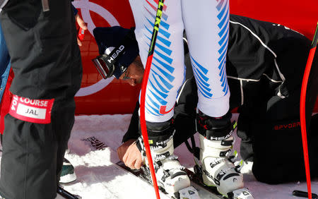 Heinz Haemmerle, or "Magic Heinzi" as US skier Lindsey Vonn calls her Austrian-born ski technician, checks the binding of the world's most successful skiing woman before the start of Vonn's third Olympic Downhill training run at the Winter Olympics 2018 in Pyeongchang, South Korea February 20, 2018. REUTERS/Leonhard Foeger