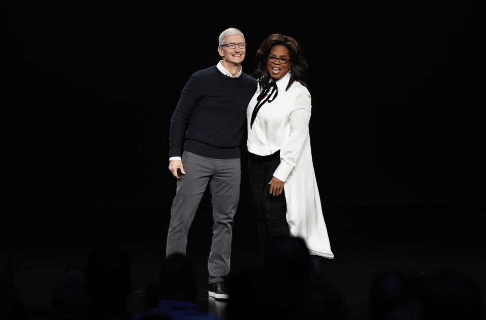 Apple CEO Tim Cook and Oprah Winfrey at the Steve Jobs Theater during an event to announce new products Monday, March 25, 2019, in Cupertino, Calif. (AP Photo/Tony Avelar)