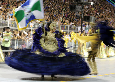 Spectators watch the Vila Maria samba school parade during the carnival in Sao Paulo, Brazil February 25, 2017. REUTERS/Paulo Whitaker