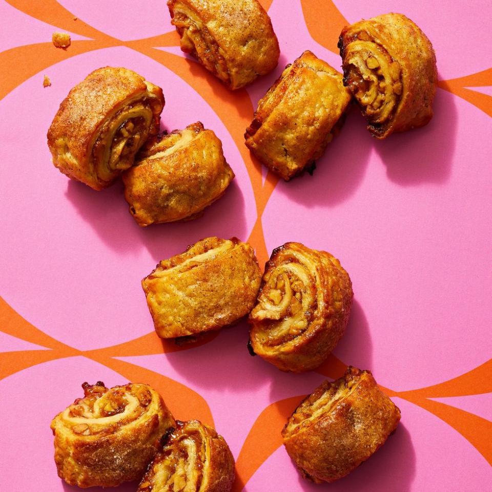 <p>These mini-pastries are made with spiced sugar, jam, and toasted walnuts, all rolled up in a perfectly buttery, flaky crust. </p><p>Get the <a href="https://www.goodhousekeeping.com/food-recipes/dessert/a41792754/walnut-rugelach-recipe/" rel="nofollow noopener" target="_blank" data-ylk="slk:Jammy Walnut Rugelach recipe;elm:context_link;itc:0;sec:content-canvas" class="link "><strong>Jammy Walnut Rugelach recipe</strong></a>. </p>