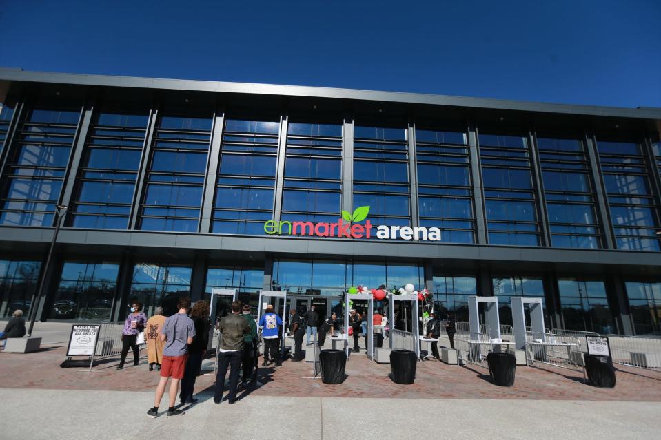 Guests make their way through security at the Enmarket Arena.