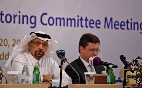 Saudi Energy Minister Khaled al-Faleh (L) and Russian Energy Minister Alexander Novak  - Credit: AMER HILABI/AFP