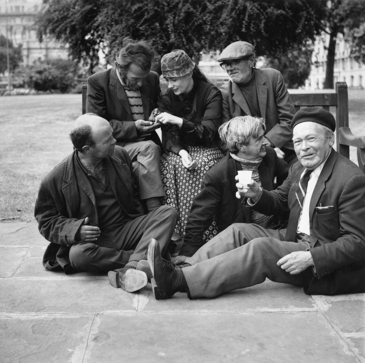 A group of homeless men and Peralta sitting at Marble Arch (Moyra Peralta/Courtesy of Bishopsgate Institute)