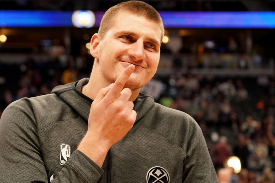 DENVER, CO - NOVEMBER 22: Nikola Jokic #15 of the Denver Nuggets jokes around against the Boston Celtics in the first half at Pepsi Center on November 22, 2019 in Denver, Colorado. NOTE TO USER: User expressly acknowledges and agrees that, by downloading and/or using this photograph, user is consenting to the terms and conditions of the Getty Images License Agreement (Photo by Jamie Schwaberow/Getty Images)